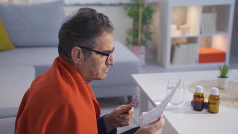 sick mature man feeling unwell at home and using medical medicine.