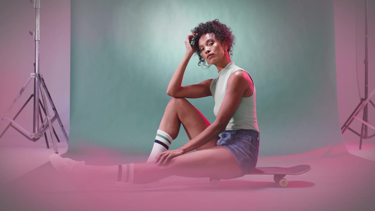 Young Woman Posing in Studio with Smoke Effects and Logo Reveal