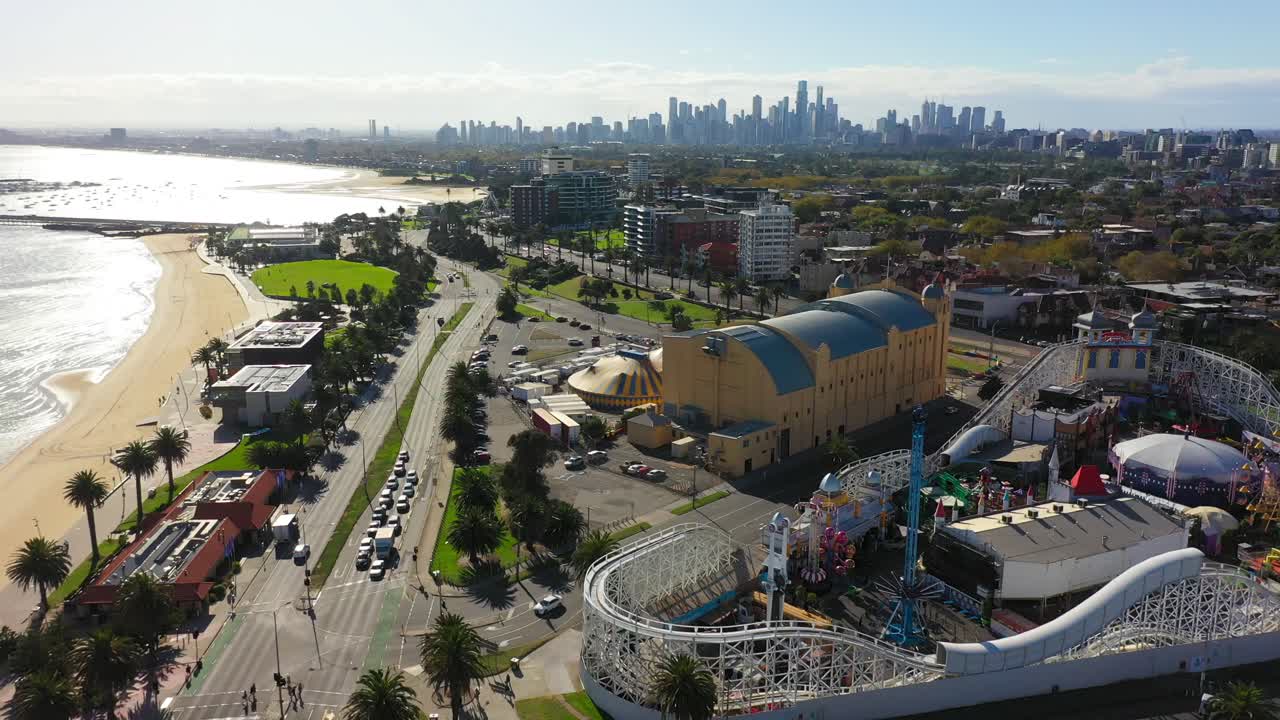 Aerial footage flying past St Kilda's beach famous amusement park, the Luna Park Melbourne
