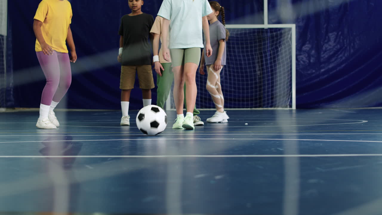 Kids kicking soccer ball