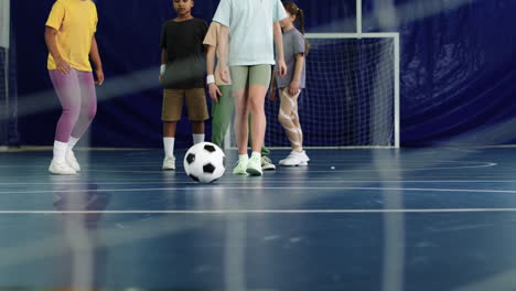 kids kicking soccer ball