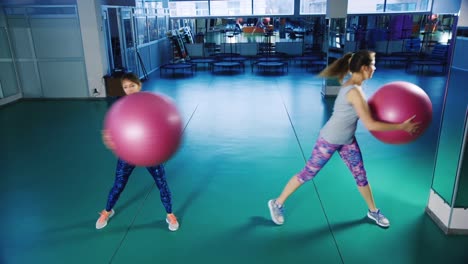 Young-women-do-yoga-in-the-gym-2