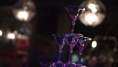 pyramid of martini glasses with raspberries