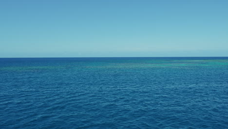 calm water at the great barrier reef in the coral sea