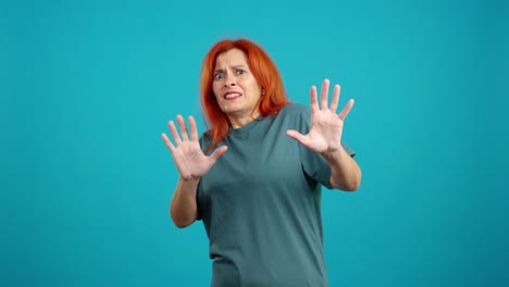 woman with red hair expressing fear and disgust