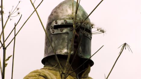 close up of medieval knight keeping watch at codnor castle, derbysire, england
