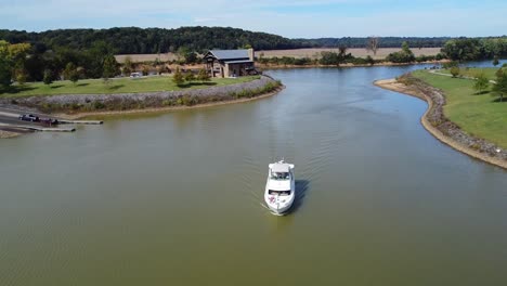 aerial footage of luxury boat getting ready to dock at marina