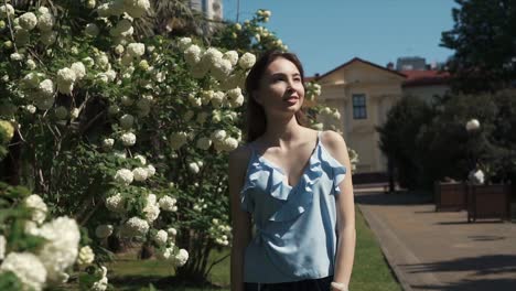 woman in a blue dress in a park