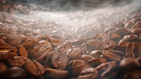 Close-up-of-seeds-of-coffee.-Fragrant-coffee-beans-are-roasted-smoke-comes-from-coffee-beans.