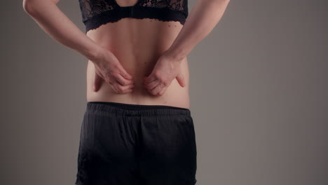 Woman Massaging Back Pain
