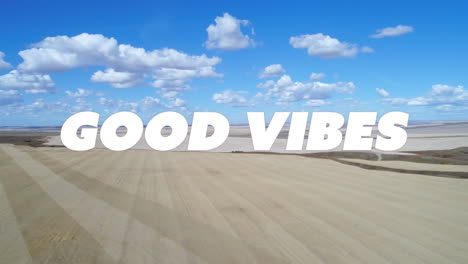 animation of good vibes text over landscape and clouds in background