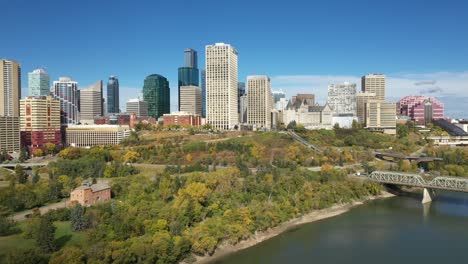 daytime aerial drone view of downtown edmonton and the north saskatchewan river during autumn fall taken from rossdale area