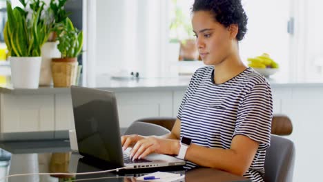 Young-woman-using-laptop-4k