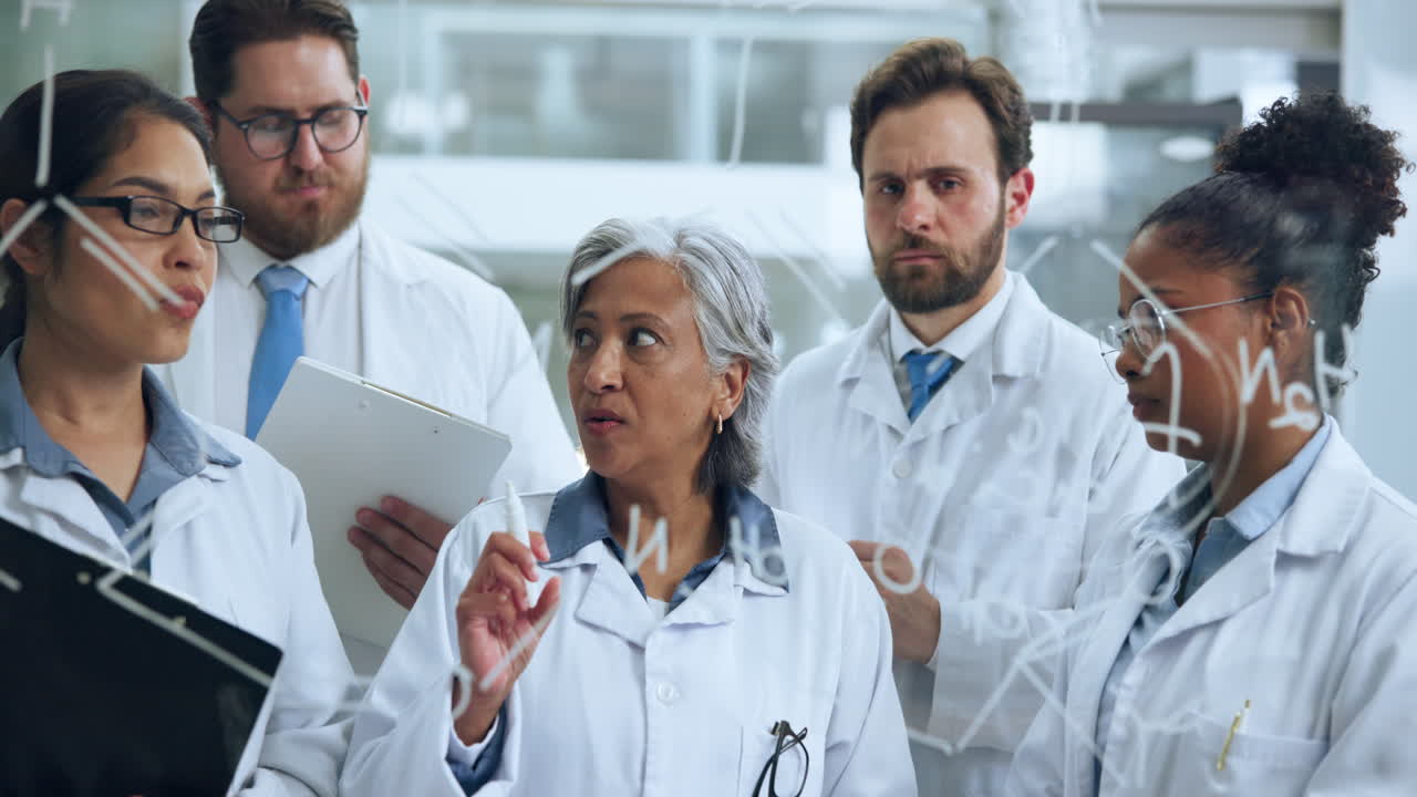 Diverse Group of Scientists Discussing Formulas on Glass Board