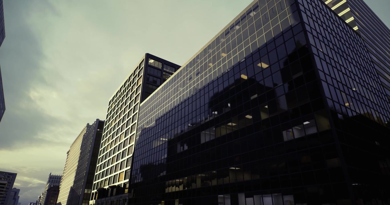 Sleek glass highrise reflecting city skyline with steel accents