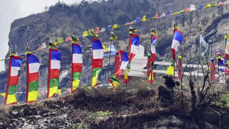 vibrant buddhist prayer flags flutter in the himalayan wind along the everest base camp trail, symbolizing peace and blessings.