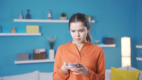 Young-woman-who-is-restless-and-unhappy-with-what-she-sees-on-the-phone.