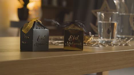 Close-Up-Of-Gift-Boxes-On-Table-In-Muslim-Home-Celebrating-Eid-1