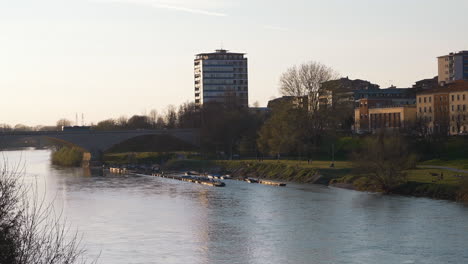 Awesome-view-of-bridge-over-Ticino-river-in-Pavia-city-at-sunset,-Background-urban-skyline,Lombardy,-italy