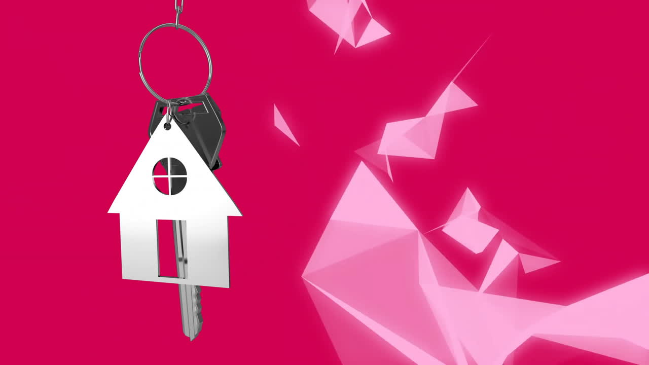 Animation d'une clé avec un porte-clés maison sur des formes sur fond rouge