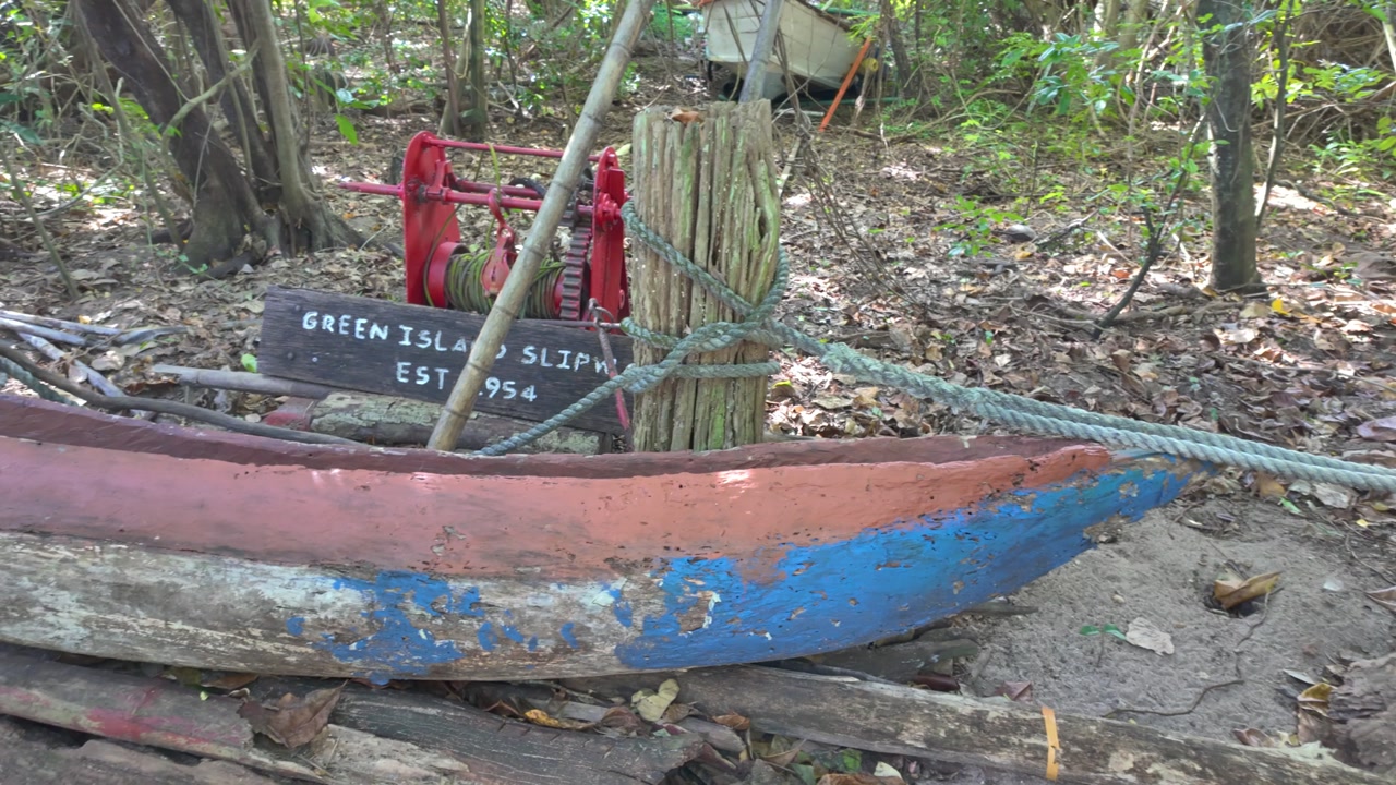 4K sweeping View of an old slipway display in a tropical rainforest on Green Island in North Queensland, Australia