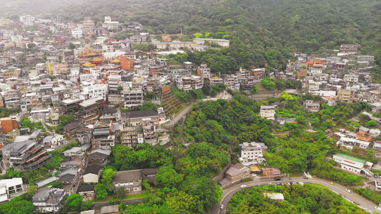 A breathtaking aerial view of Jiufen Mountain, a picturesque mountain village nestled in the outskirts of Taipei, Taiwan
