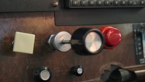 throttle lever in small airplane cockpit in flight, close up panel