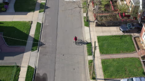 an aerial shot taken over a suburban neighborhood on a sunny day