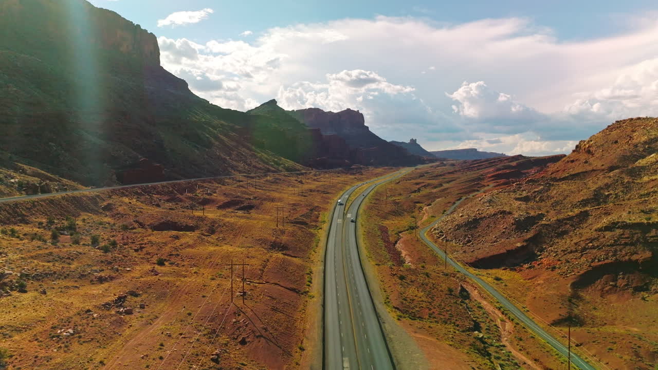 Motorway through the valley among beautiful rocks. Stunning Utah canyons in the rays of summer sun.