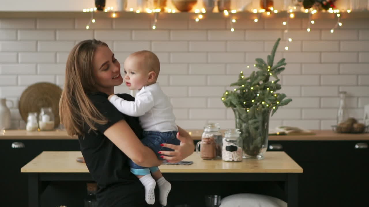 Mother And Her Baby Son Having Fun And Playing At Home. Little Kid 2 Years  Old Play With His Mom Arms At Home Near A Big Window Free Stock Video  Footage Download