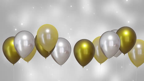 animación de globos de oro y plata con fondo plateado