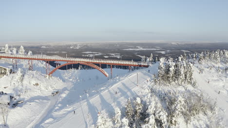 Wide-drone-shot-of-a-cold-winter-with-a-lot-of-snow-at-a-ski-resort-in-Branäs,-Sweden