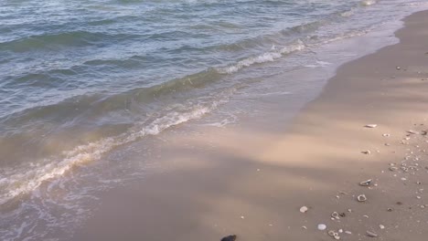 Waves-in-the-ocean-and-sand-on-the-beach,-blue-sky-sunny-day-in-Thailand