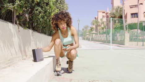 woman in roller skates setting on music