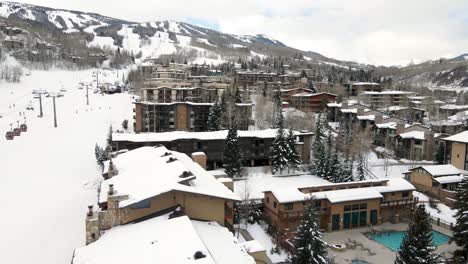 aerial drone shot of hotels in ski resort area in aspen, colorado