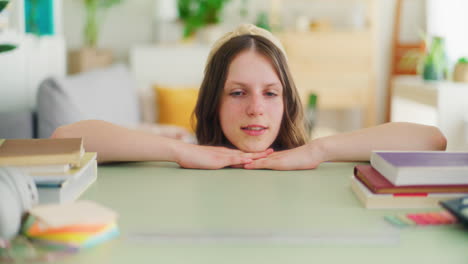 a school-age girl terrified by the amount of books to read