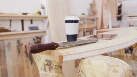 close up of multiple surfboard maker tools on a table