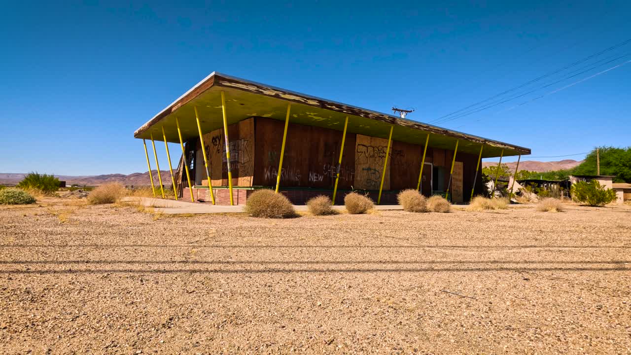 Abandoned boarded up restaurant in the desert