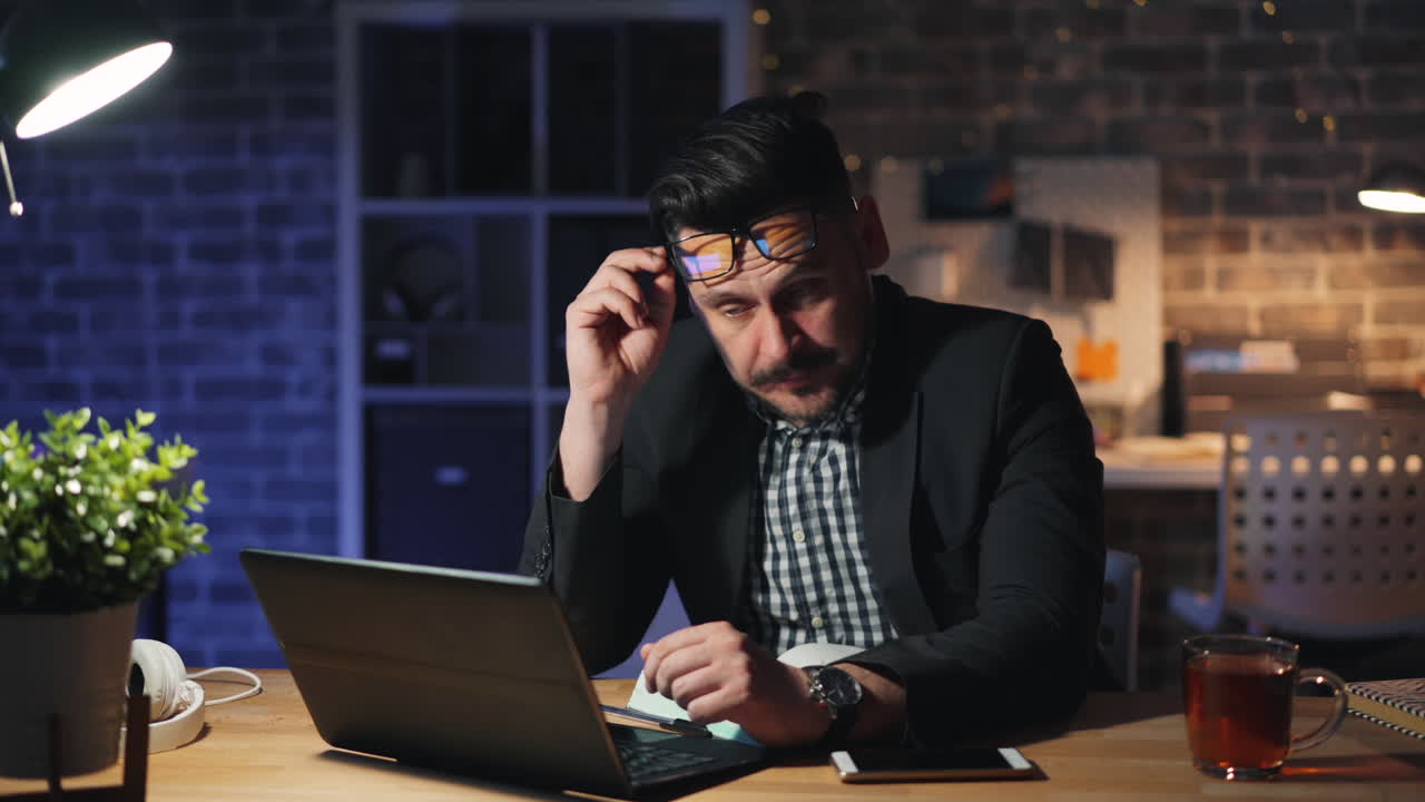 Tired Businessman Working Late at Night