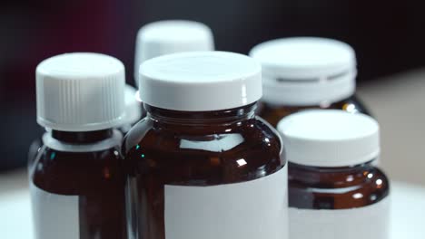 Medical-bottles-rotating-on-table.-Pharmacy-bottles.-Pharmaceutical-industry