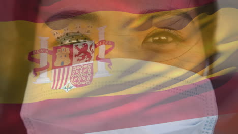 animation of flag of spain waving over woman wearing face mask during covid 19 pandemic