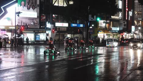 4k cinematic footage of karting crossing shibuya during a rainy night