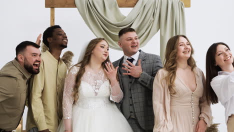 wedding couple and friends at the altar