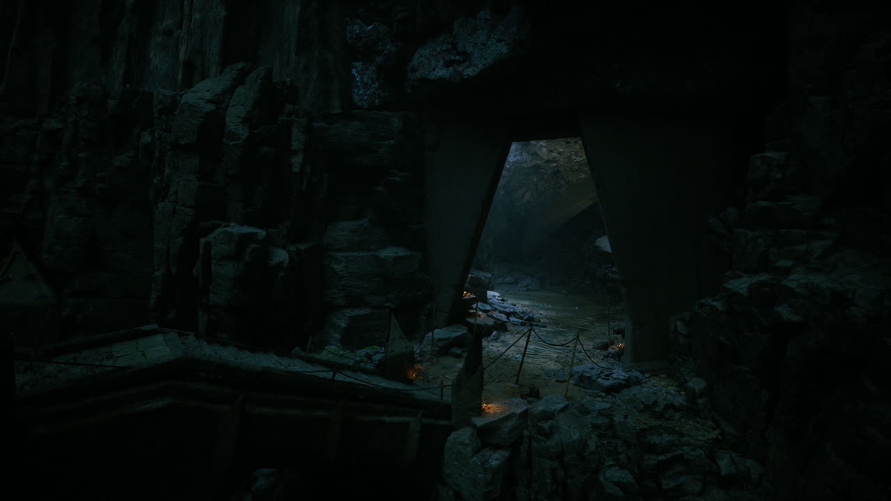 Majestic stone archway in a dark cave illuminated by soft light