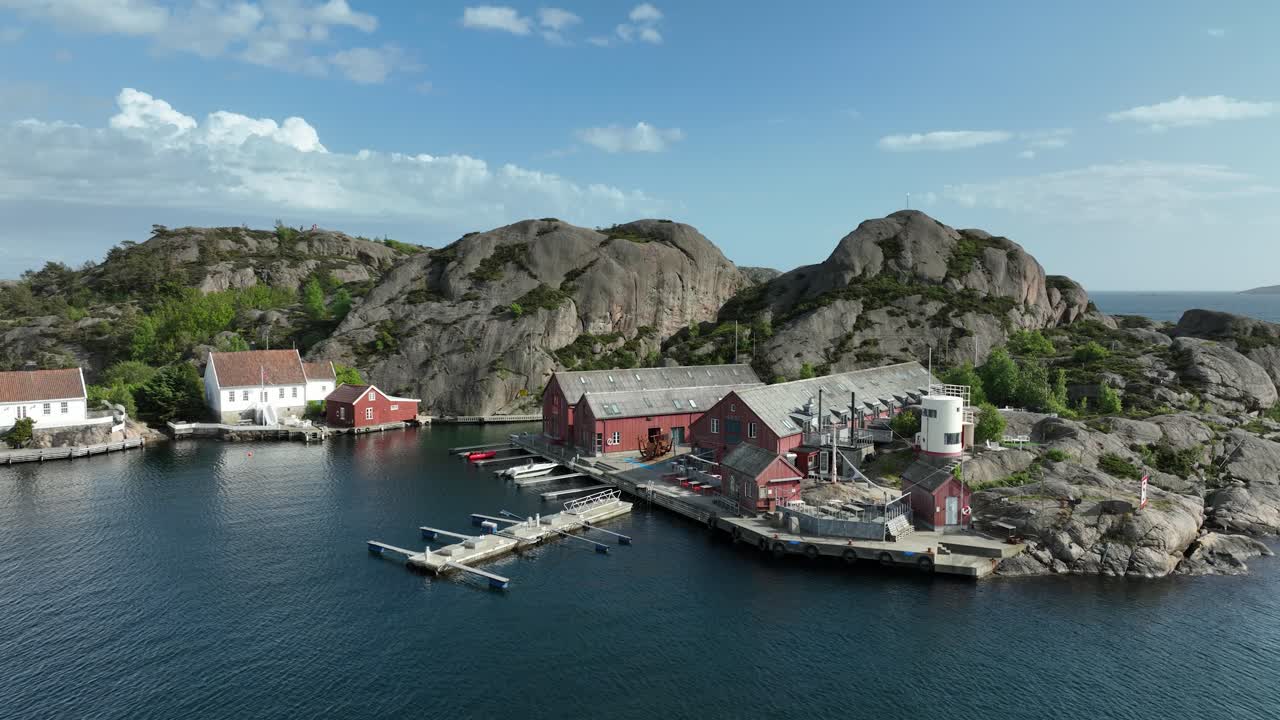 Drone flying along the rugged coastline of Ny-Hellesund.