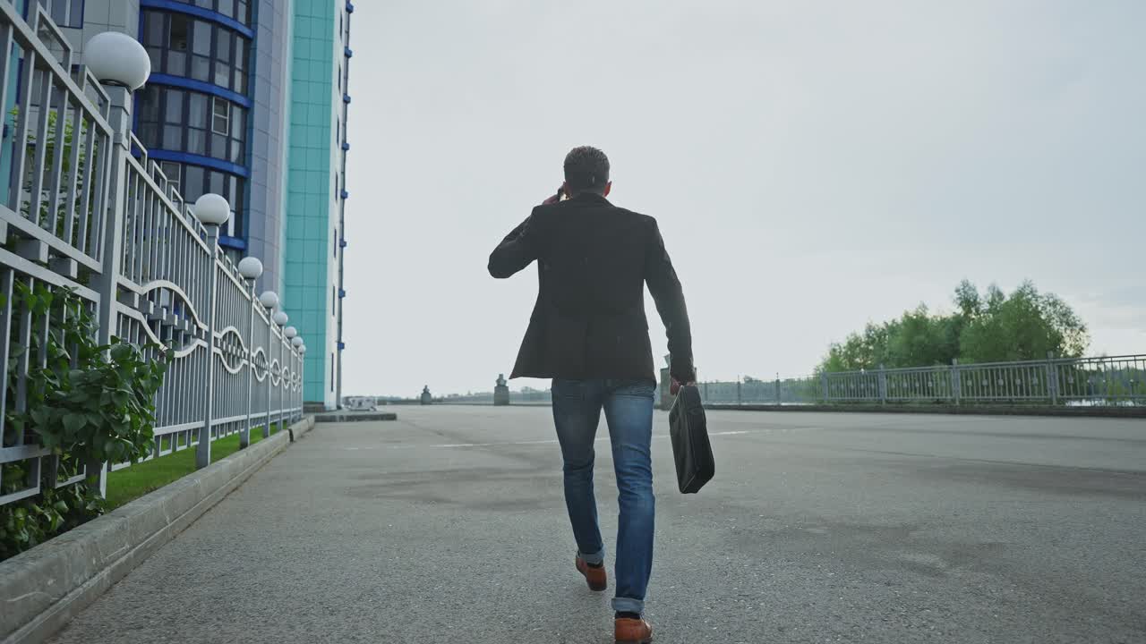 Businessman Walking on City Street