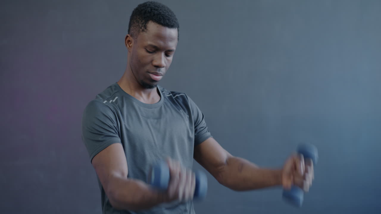 Man Lifting Dumbbells