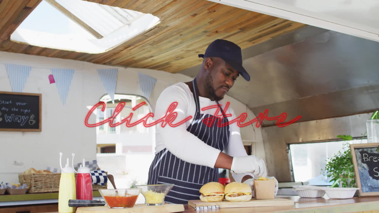 Preparing burgers in food truck, chef using animation for menu display
