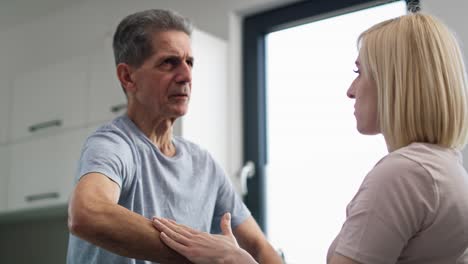 Female-physical-therapist-working-with-senior-man.