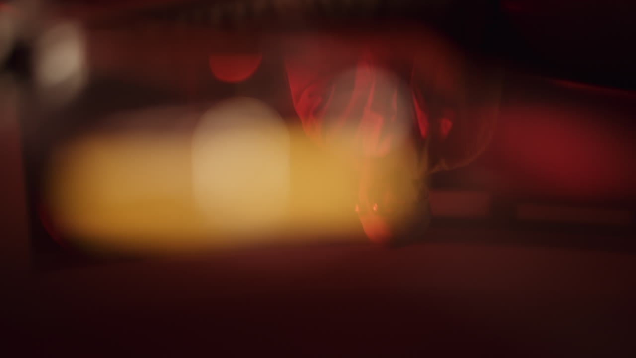 Person in Red Clothing Under Lights